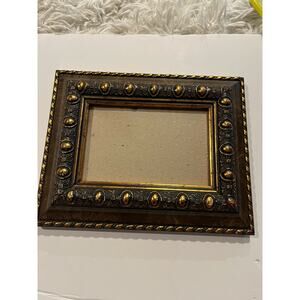 8x10 ornate frame holds 4X6 photo gold brushed design  on hard plastic not wood